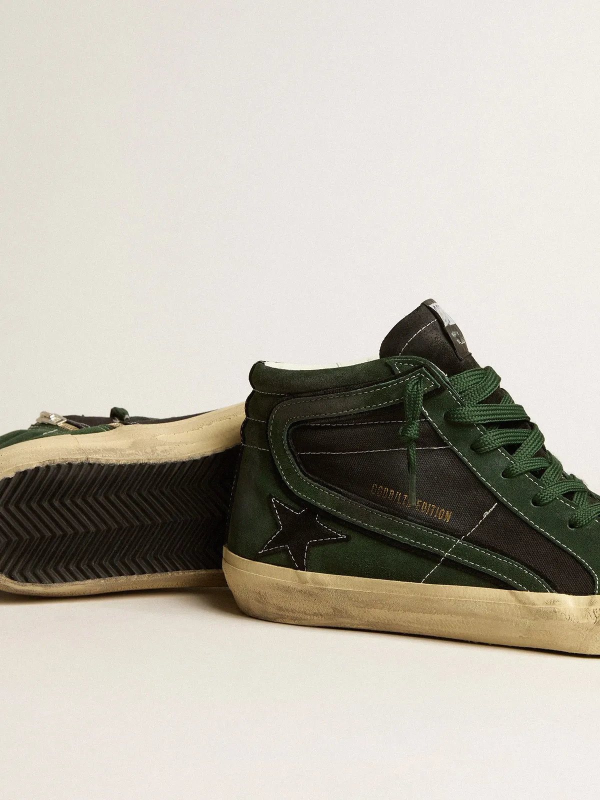Slide LTD in suede verde e canvas nero con stella e virgola in suede